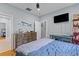 Bedroom with blue decor, TV, hardwood floors, and a window offers a relaxing space at 110 Huntington Ct, Walterboro, SC 29488