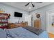 Comfortable bedroom featuring a ceiling fan, hardwood floors, dresser and a TV at 110 Huntington Ct, Walterboro, SC 29488