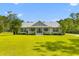 Charming one-story home with a welcoming front porch and beautifully manicured lawn and garden at 110 Huntington Ct, Walterboro, SC 29488