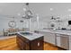 Kitchen and dining area featuring a marble island, stainless appliances, and an open floor plan at 110 Huntington Ct, Walterboro, SC 29488