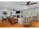 Spacious living room boasts hardwood floors, ceiling fans, and a cozy fireplace at 110 Huntington Ct, Walterboro, SC 29488