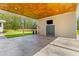 Spacious outdoor patio featuring a television and views of the backyard at 110 Huntington Ct, Walterboro, SC 29488