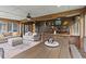 Beautiful sun room features wood accents, a bar area, and plenty of natural light at 110 Huntington Ct, Walterboro, SC 29488