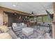 Relaxing sun room with exposed wood beams, bar seating, and comfortable couches at 110 Huntington Ct, Walterboro, SC 29488