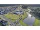 Overhead view of community with a lake, pool and clubhouse, showcasing the idyllic setting for residents at 110 True Blue Lp, Summerville, SC 29486