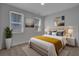 Bright bedroom with modern decor, featuring two windows, a comfortable bed, and stylish artwork at 110 True Blue Lp, Summerville, SC 29486