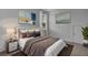 Cozy bedroom featuring a comfy bed with decorative pillows and modern artwork at 110 True Blue Lp, Summerville, SC 29486
