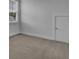 Neutral bedroom featuring a double-hung window, grey carpet, neutral walls, and a white door at 110 True Blue Lp, Summerville, SC 29486