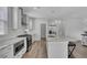 Modern, open kitchen with stainless appliances and a large island with seating at 110 True Blue Lp, Summerville, SC 29486
