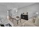 Bright living room with a staircase, modern decor, neutral furniture, and wood-look floors at 110 True Blue Lp, Summerville, SC 29486