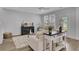 Comfortable living room featuring neutral furniture, a modern entertainment center, and a view to the outdoors at 110 True Blue Lp, Summerville, SC 29486