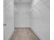 Spacious walk-in closet with wire shelving and neutral carpet at 110 True Blue Lp, Summerville, SC 29486