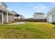 Spacious backyard with grass and a patio, and a fence separating properties at 113 Jackson Pond Ct, Summerville, SC 29486