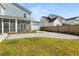 Landscaped backyard with a patio, lawn, and a view of the rear of the house and garage at 113 Jackson Pond Ct, Summerville, SC 29486
