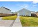 Backyard featuring a walkway from the patio to a detached garage at 113 Jackson Pond Ct, Summerville, SC 29486