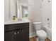 Well-lit bathroom featuring a modern vanity, toilet, and a tiled shower-tub combination at 113 Jackson Pond Ct, Summerville, SC 29486