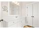 Bright bathroom with white vanity, quartz countertop, and a framed mirror at 113 Jackson Pond Ct, Summerville, SC 29486
