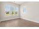 Well-lit bedroom with hardwood floors and large windows offering a neighborhood view at 113 Jackson Pond Ct, Summerville, SC 29486