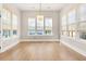 Spacious dining room is filled with light through the many windows with bamboo blinds at 113 Jackson Pond Ct, Summerville, SC 29486