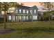 Charming two-story home featuring a welcoming front porch and manicured lawn at 113 Jackson Pond Ct, Summerville, SC 29486