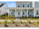 Inviting front porch with ample seating and charming details on a lovely home at 113 Jackson Pond Ct, Summerville, SC 29486