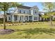 Beautiful two-story home featuring a welcoming front porch and manicured lawn at 113 Jackson Pond Ct, Summerville, SC 29486