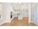 Open-concept view of kitchen, dining area, and staircase; abundant natural light from rear exterior door and windows at 113 Jackson Pond Ct, Summerville, SC 29486