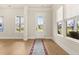 Bright living room featuring wood floors, many windows and a decorative rug at 113 Jackson Pond Ct, Summerville, SC 29486