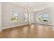 Bright living room with wood floors, recessed lighting, and large windows offering pleasant views at 113 Jackson Pond Ct, Summerville, SC 29486