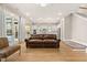 Spacious living area with wood floors, kitchen view, and glass doors for natural light at 113 Jackson Pond Ct, Summerville, SC 29486