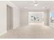 Spacious living room with neutral carpet, open layout, and abundant natural light at 113 Jackson Pond Ct, Summerville, SC 29486