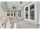 Covered back patio with ceiling fans and doors leading to the backyard at 113 Jackson Pond Ct, Summerville, SC 29486