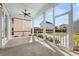 Screened-in back porch featuring a ceiling fan and views of the landscaped backyard at 113 Jackson Pond Ct, Summerville, SC 29486