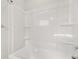 Shower and tub combo featuring a white tub, surround, and built in shelves at 113 Jackson Pond Ct, Summerville, SC 29486