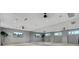 Bright studio space featuring a wall of mirrors, neutral tones, and recessed lighting at 113 Jackson Pond Ct, Summerville, SC 29486