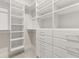 Organized walk-in closet with white shelving and drawers, maximizing storage space at 113 Jackson Pond Ct, Summerville, SC 29486