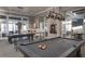 Recreational billiard room with pool tables, bar-style seating, and ample natural light at 114 Magnolia House Dr, Summerville, SC 29486