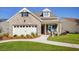 Charming single-Gathering home featuring a brick facade, well-manicured lawn, and attached two-car garage at 114 Magnolia House Dr, Summerville, SC 29486