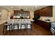Modern kitchen with granite countertops, breakfast bar, and sleek black appliances at 114 Magnolia House Dr, Summerville, SC 29486