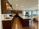 Gourmet kitchen with dark wood cabinets, granite countertops, and stainless steel appliances at 114 Magnolia House Dr, Summerville, SC 29486