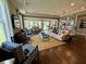 Inviting living room with a plush sofa, patterned armchairs, and an open layout to the dining area at 114 Magnolia House Dr, Summerville, SC 29486
