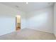 This bedroom features neutral carpet, white walls and an ensuite bathroom at 124 Pontoria Dr, Knightsville, SC 29483