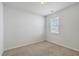This bedroom features neutral carpet, white walls and a window at 124 Pontoria Dr, Knightsville, SC 29483