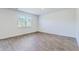 This bedroom features wood floors, a window and white walls at 124 Pontoria Dr, Knightsville, SC 29483