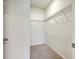 Walk-in closet features wire shelving and neutral carpet flooring for clothing storage at 124 Pontoria Dr, Knightsville, SC 29483