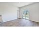 Bright dining area featuring wood floors and a sliding glass door to the backyard at 124 Pontoria Dr, Knightsville, SC 29483