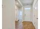 Inviting foyer with wood-look floors, neutral paint, and natural light streaming in from the front door at 124 Pontoria Dr, Knightsville, SC 29483