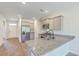 Well-equipped kitchen with stainless steel appliances, granite countertops, and adjacent dining area at 124 Pontoria Dr, Knightsville, SC 29483