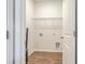 A bright laundry room featuring wood floors and washer and dryer hook ups at 124 Pontoria Dr, Knightsville, SC 29483