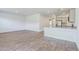 Spacious living area with wood-look floors, neutral paint, and seamless flow into the well-appointed kitchen at 124 Pontoria Dr, Knightsville, SC 29483